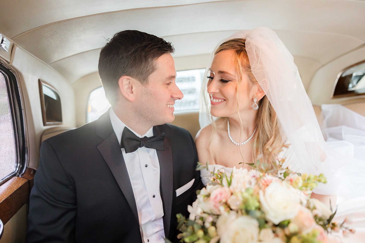 beautiful husband and wife portrait inside of the car