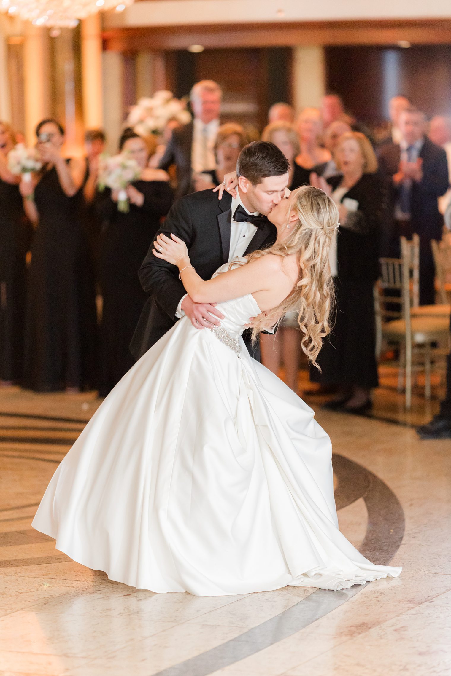 husband and wife sharing a kiss on the dance floor 