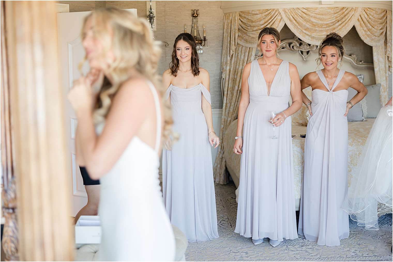 bride putting on earrings