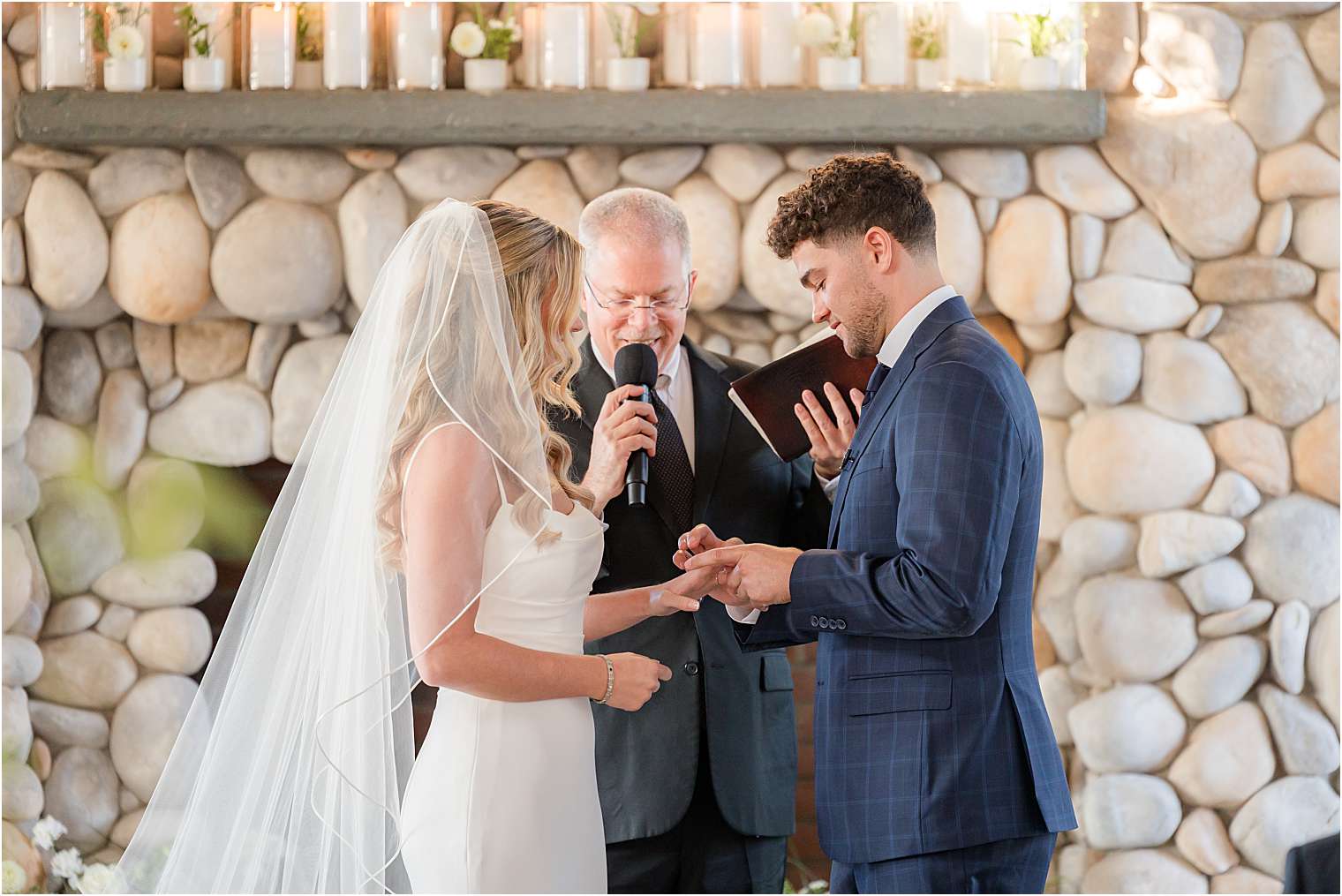 Spouses smiling at the altar