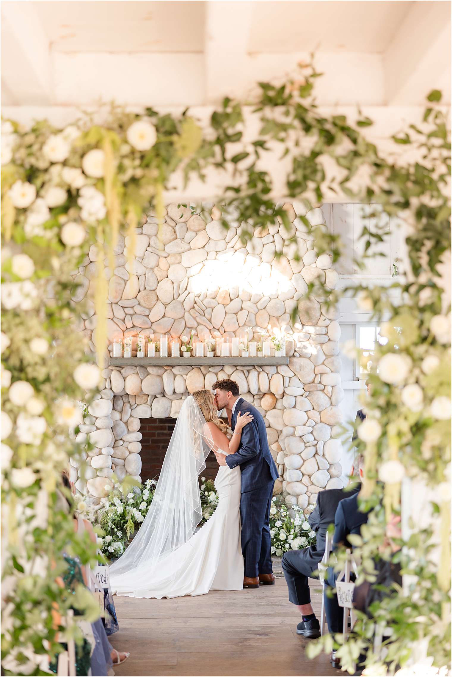 Spouses kissing at the altar