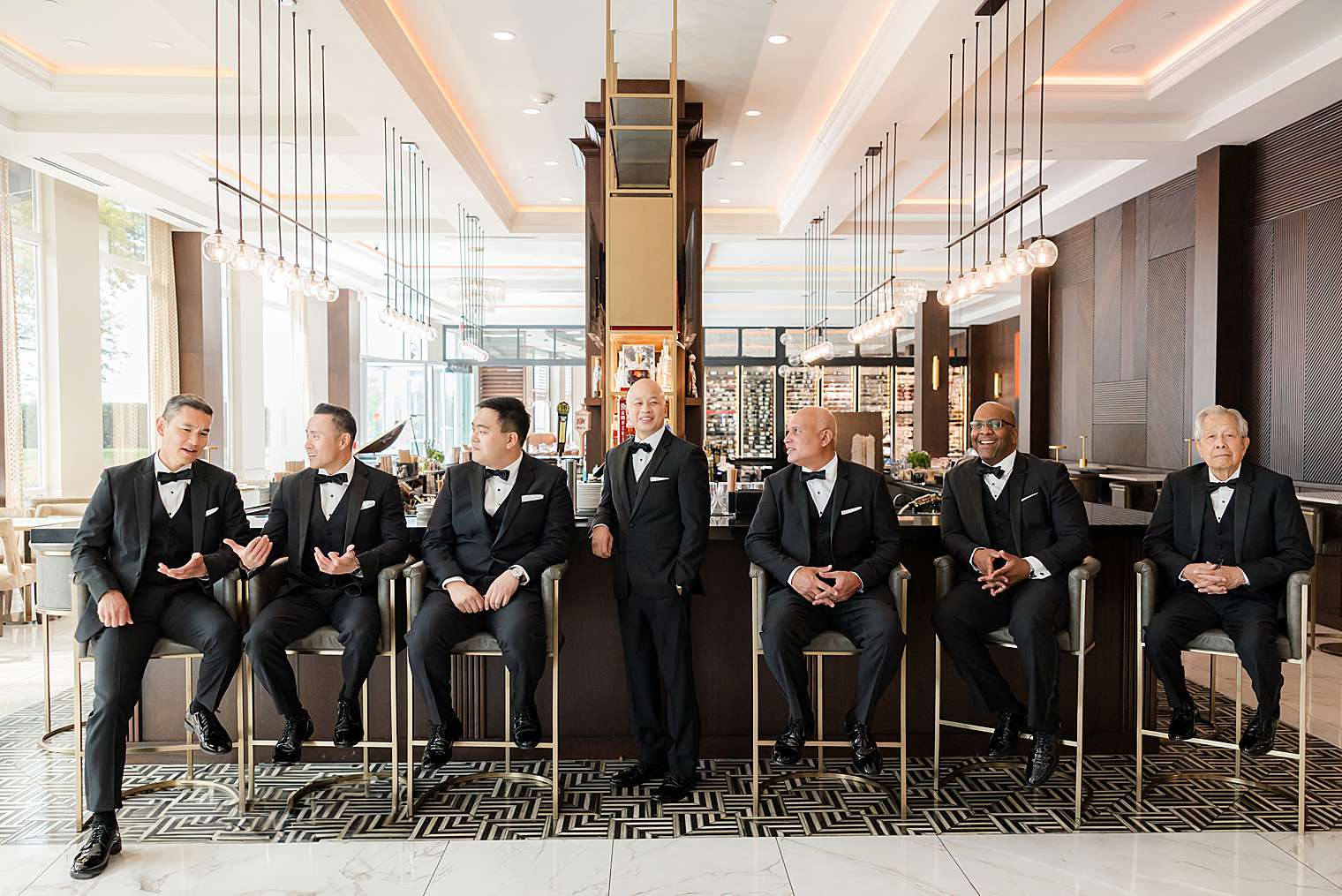 groom and groomsmen at the bar at Chateau Grande