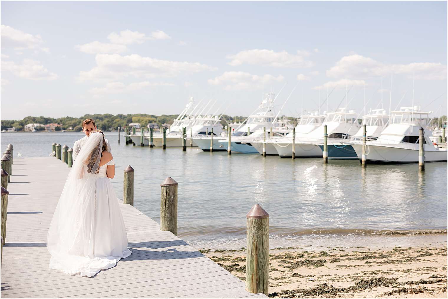 Bride and groom walking on the dock