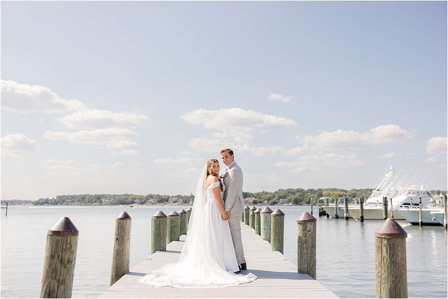 Bride and groom walking on the dock