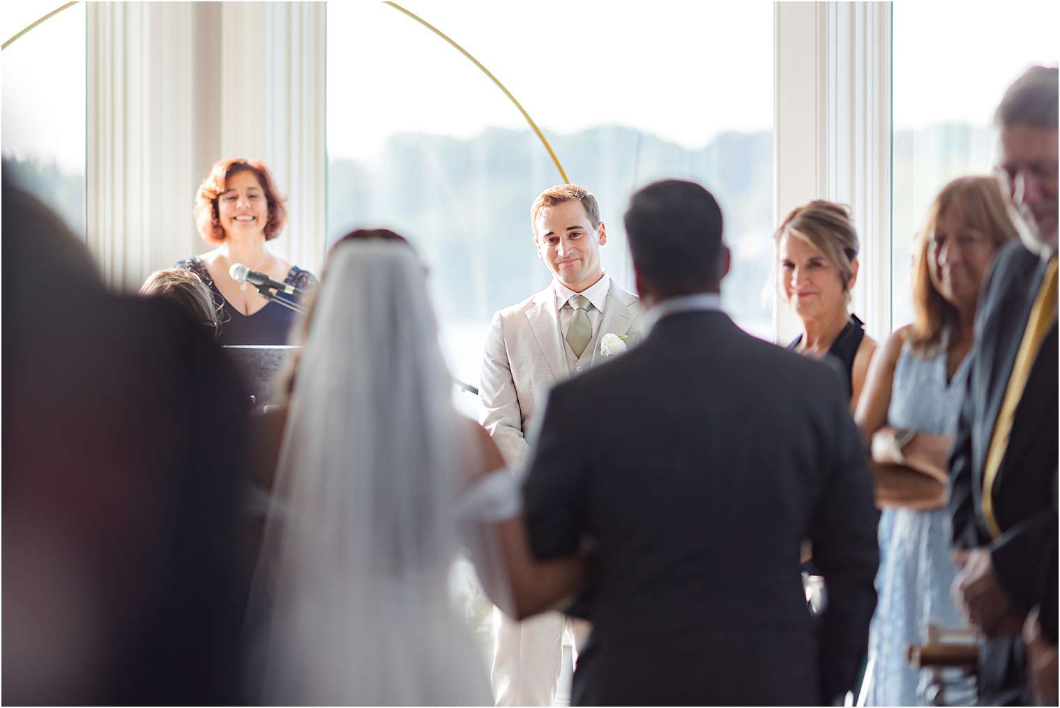 Groom's reaction as the bride walks down the aisle