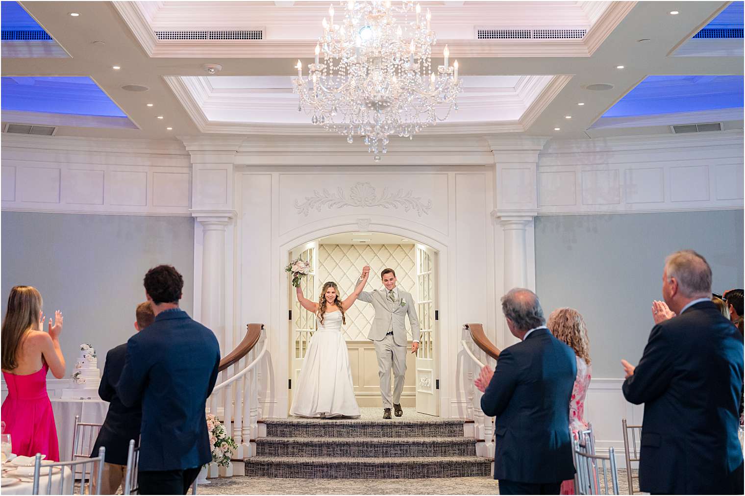 Newlyweds entering the ballroom