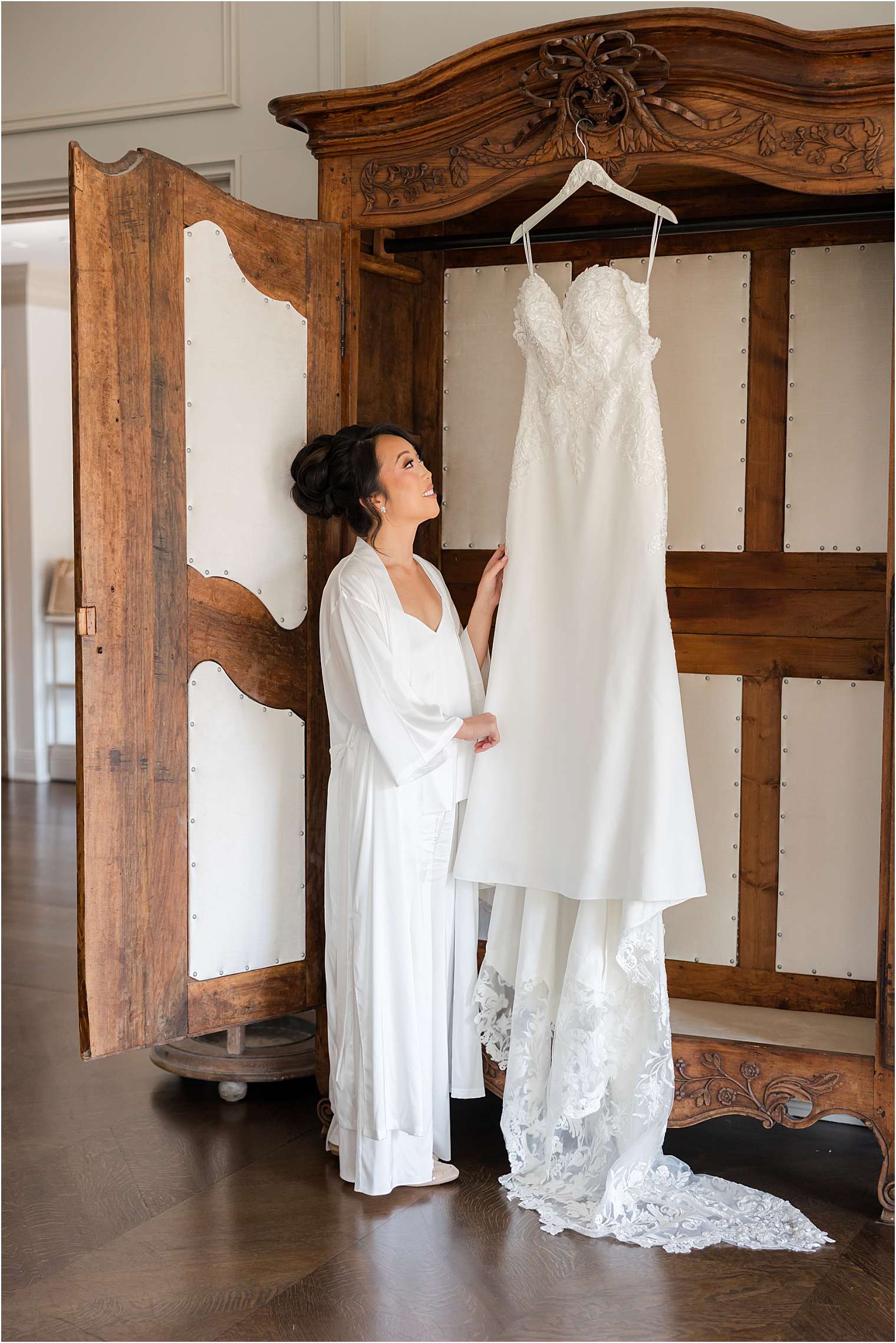 bride looking at her wedding dress