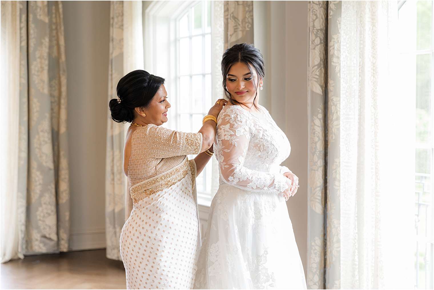 bride's mother giving the final touches