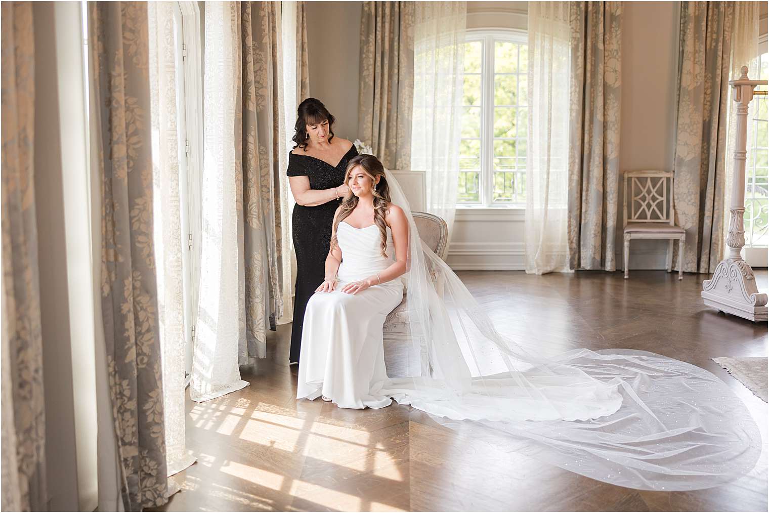 bride's mother helping her to get ready 