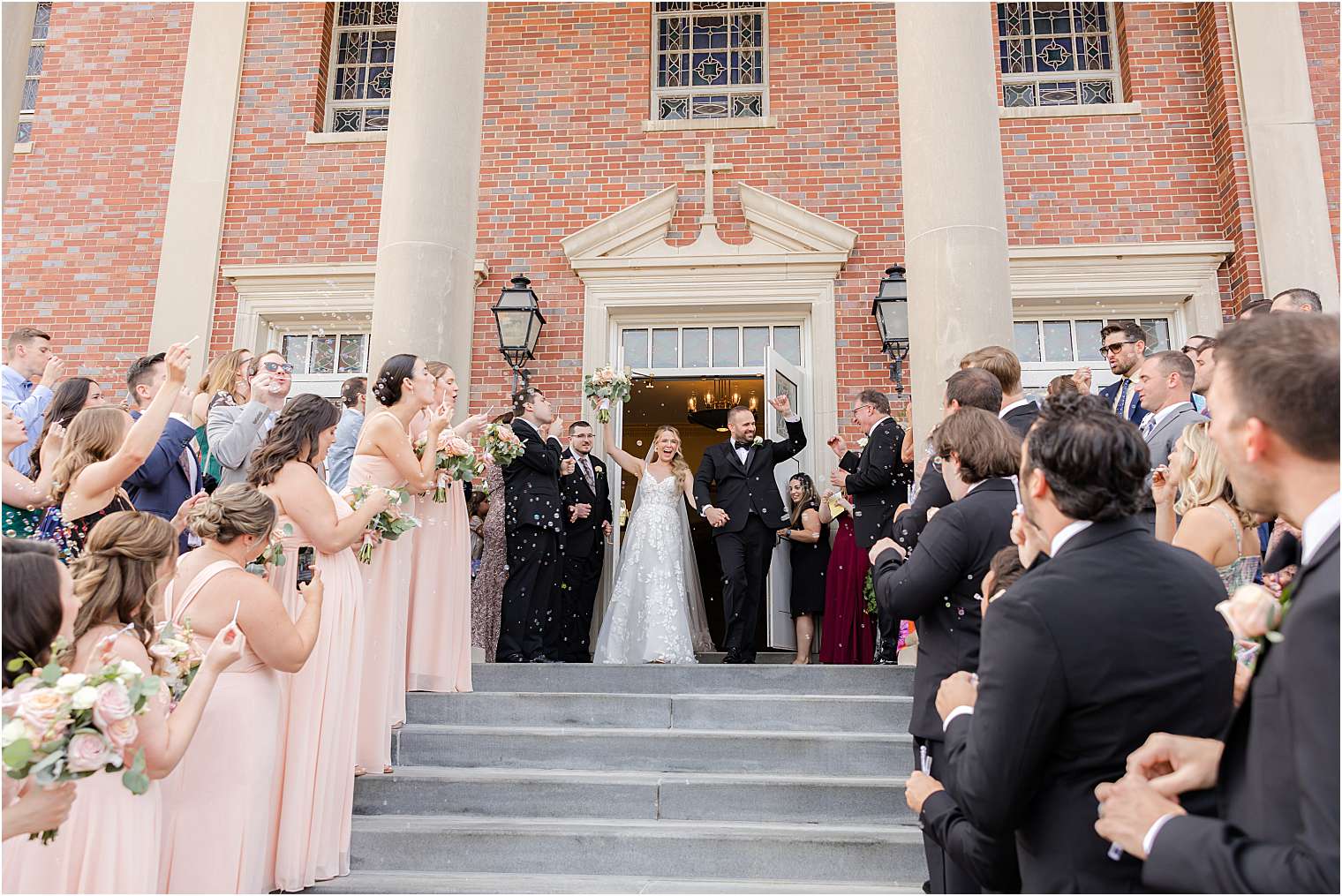 husband and wife kissing outside the church