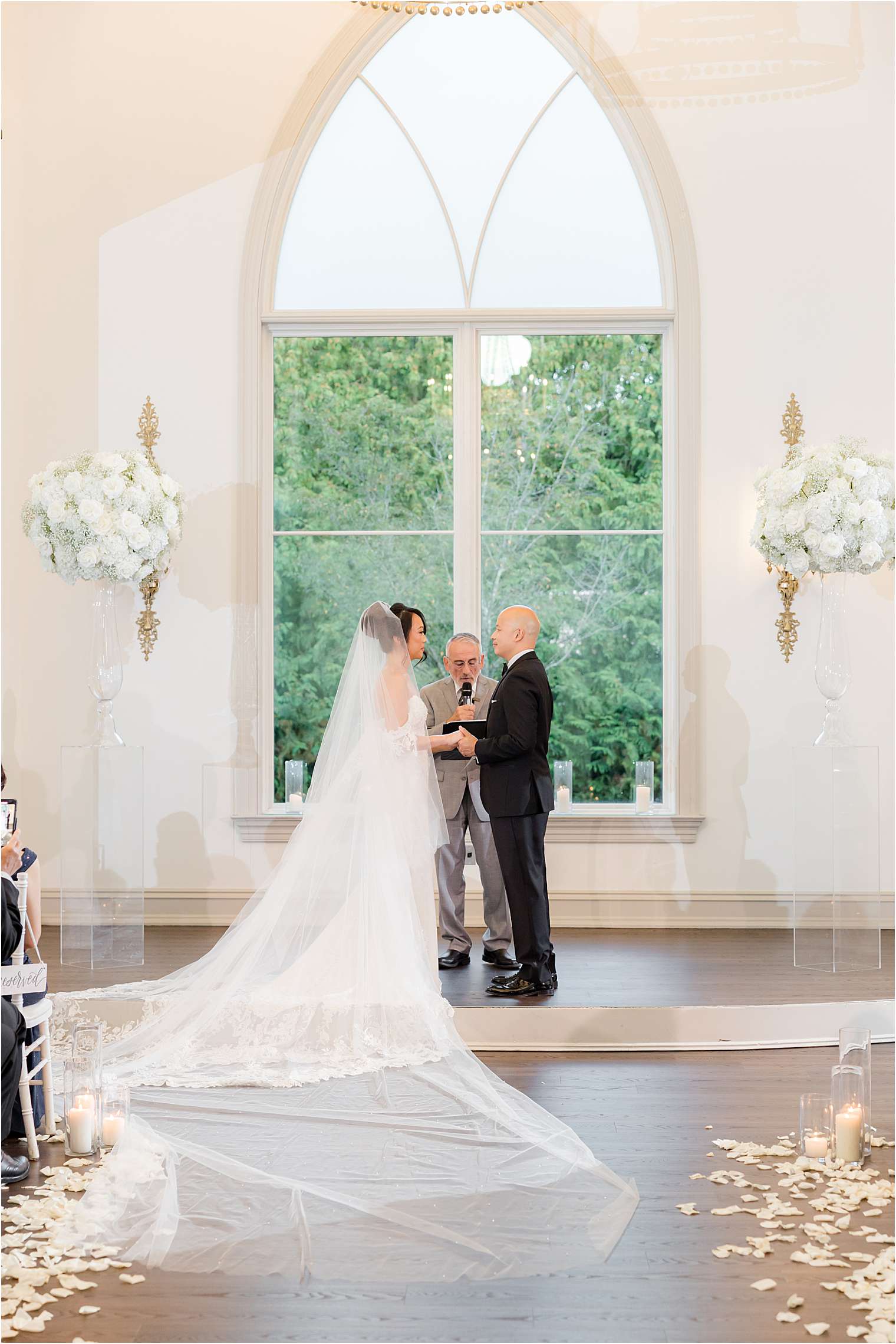 Spouses smiling at the altar