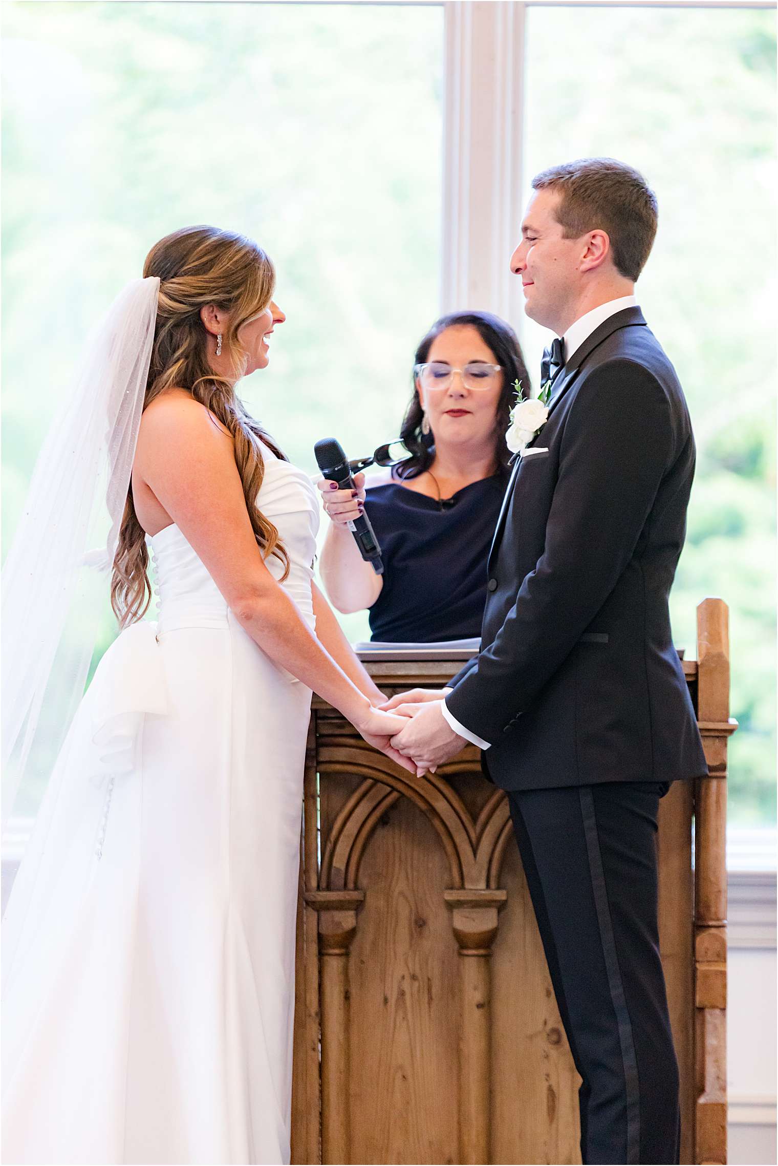 Spouses smiling at the altar