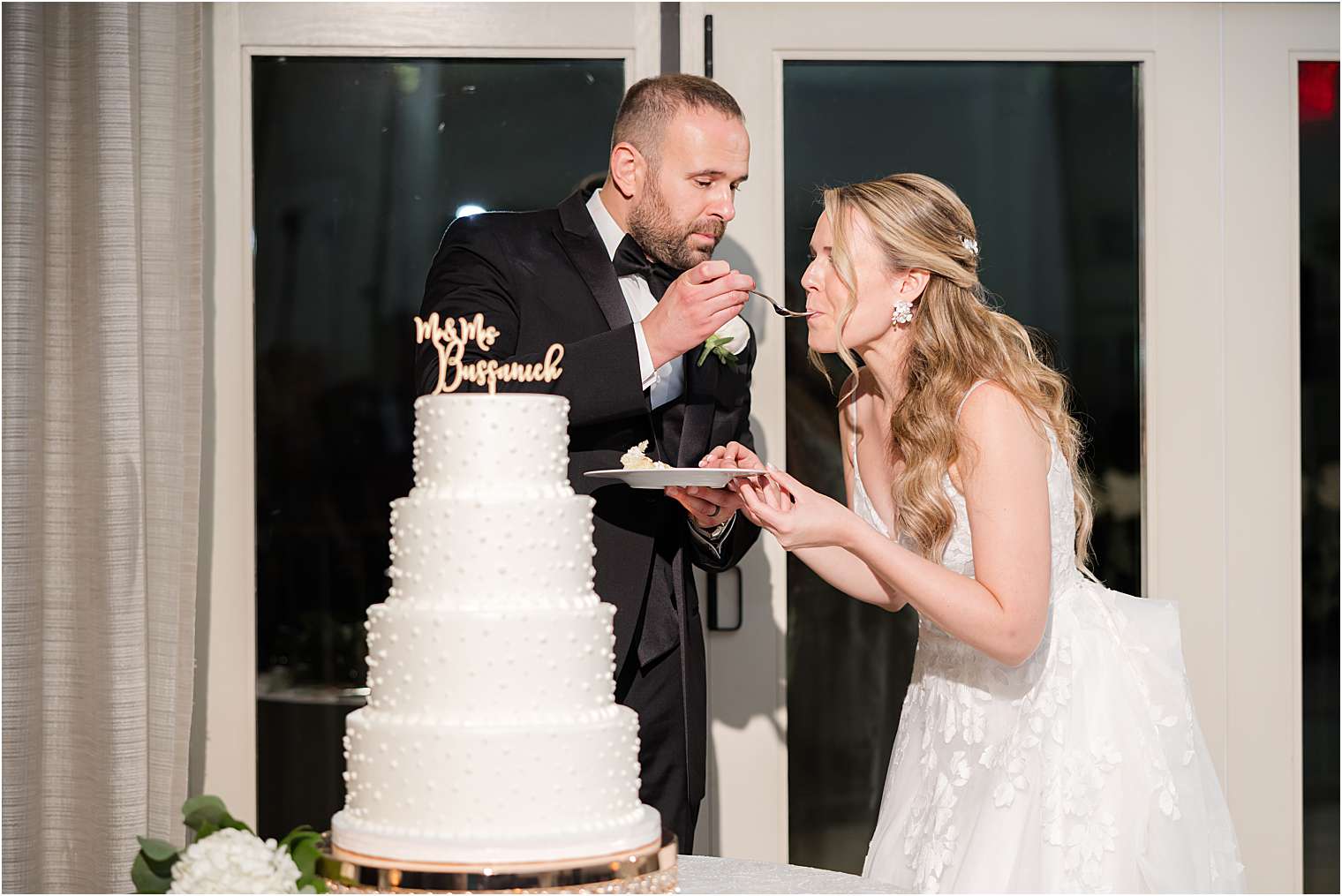 husband and wife eating cake