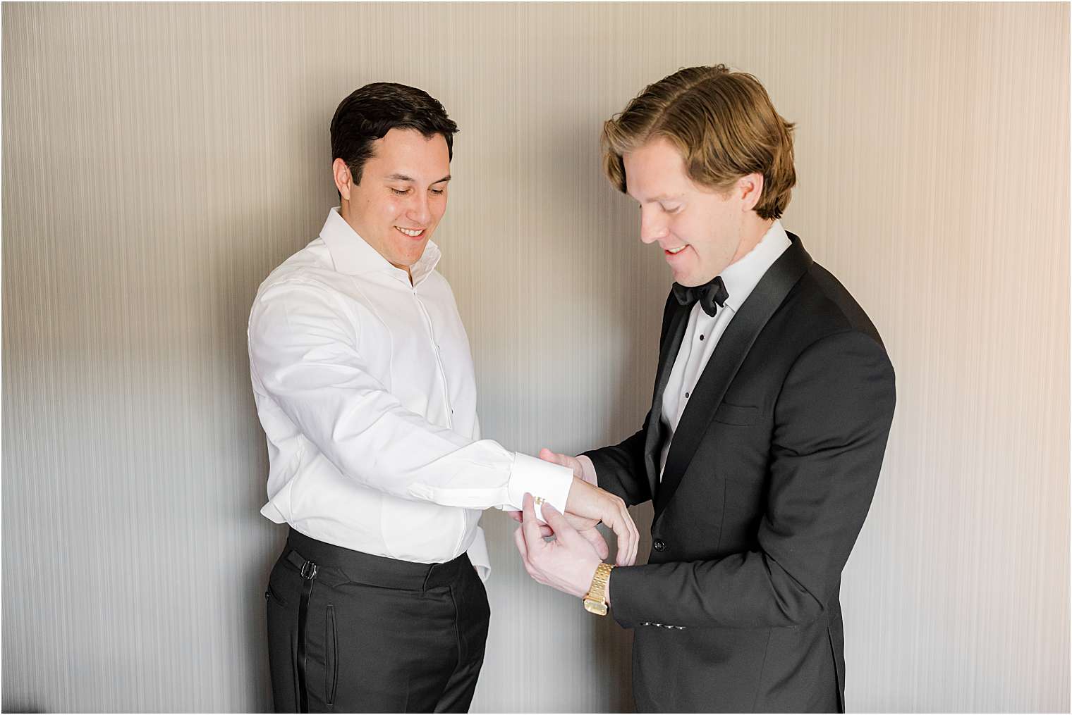 one of the best men helping the groom to get ready