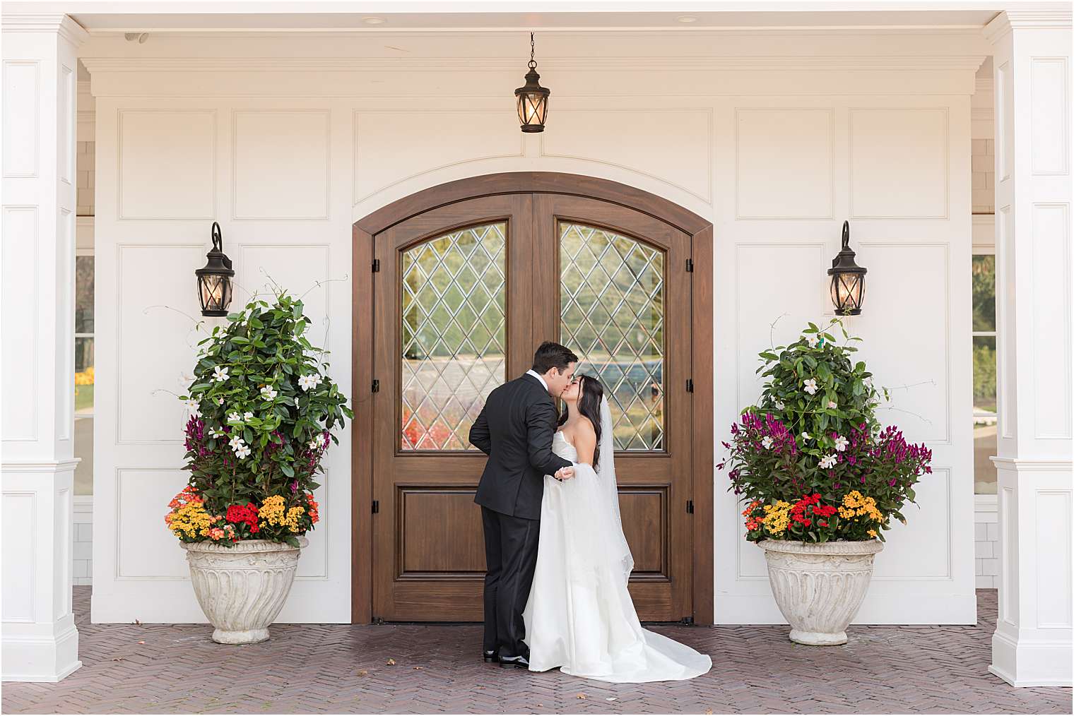 husband and wife kissing at The Mill Lakeside Manor