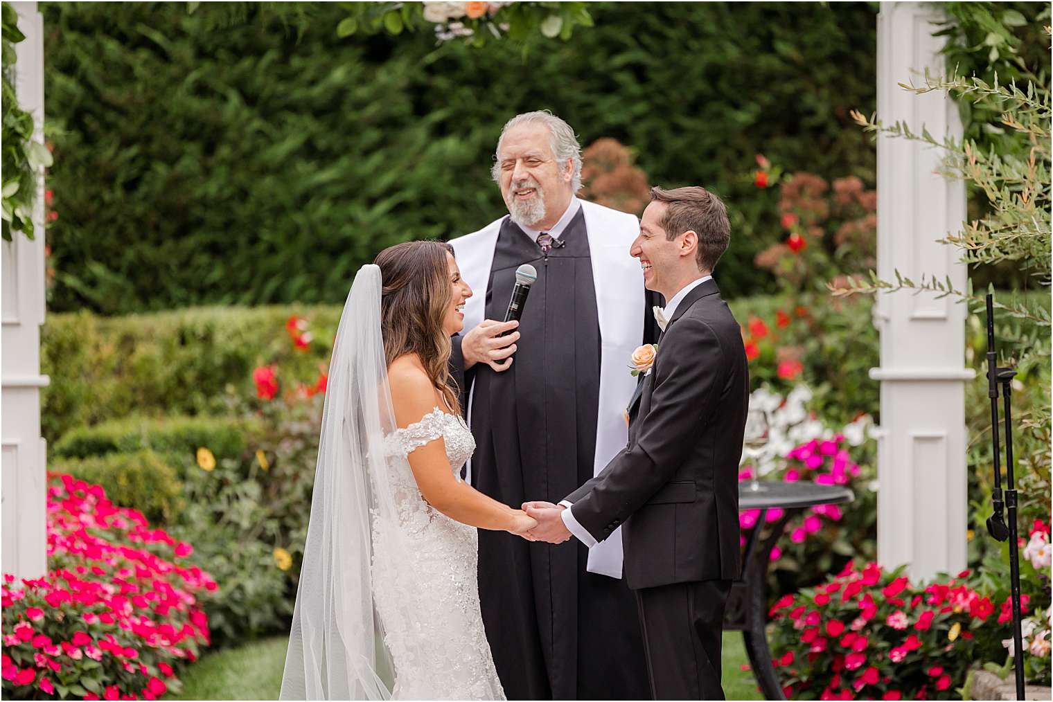 Spouses smiling at the altar