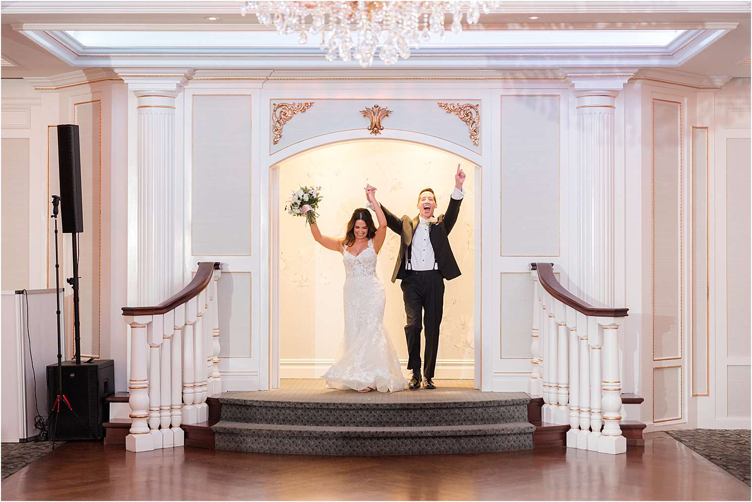 Bride and groom entering the ballroom