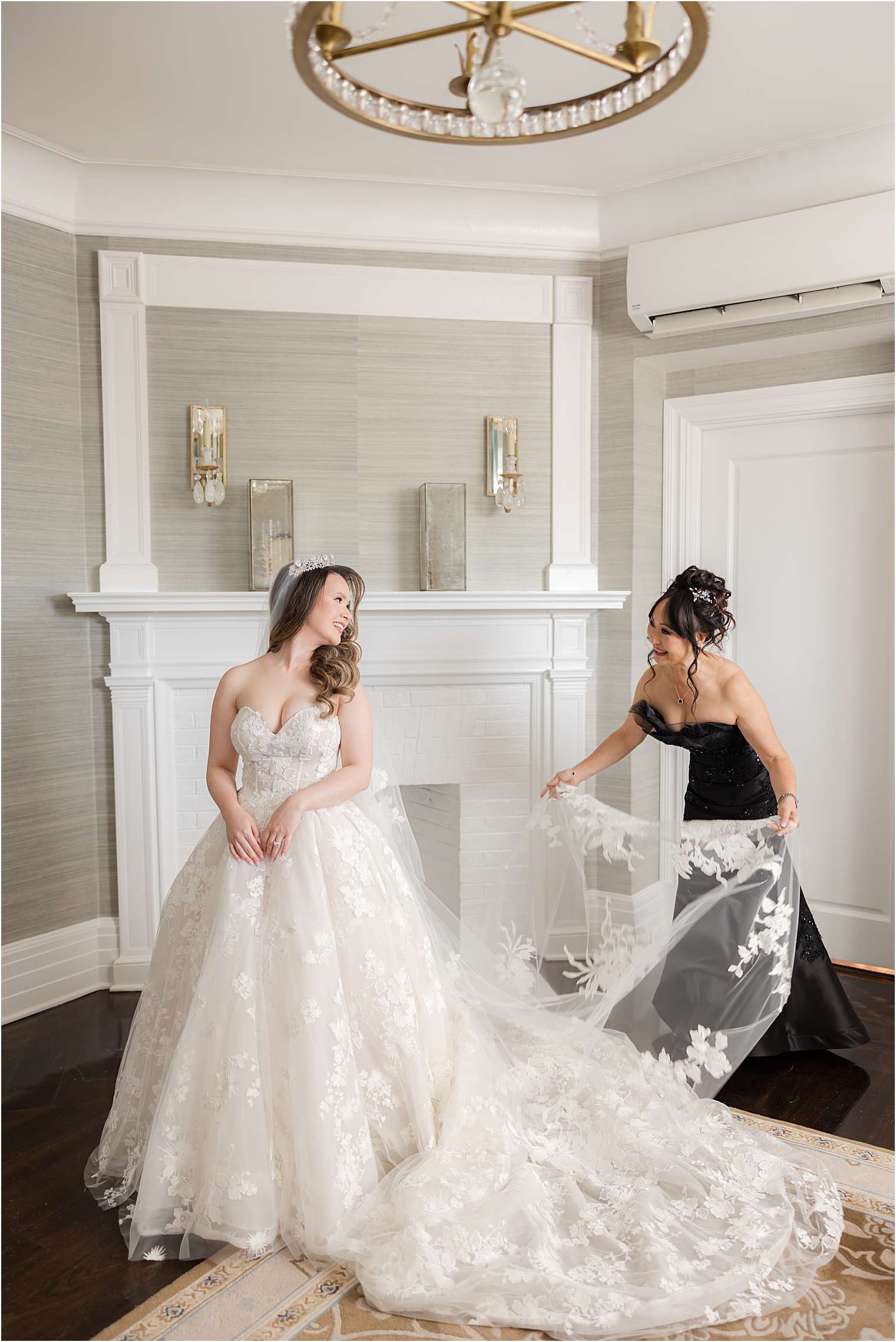 mother helping bride with final touches