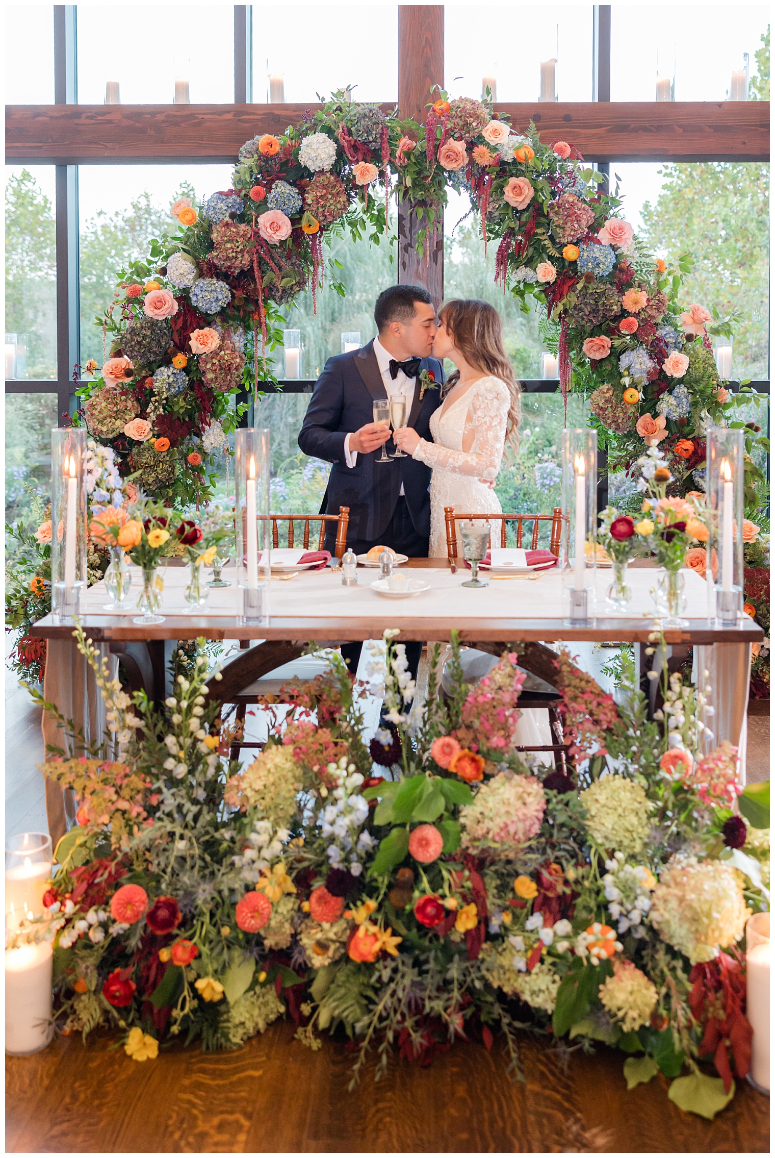 groom and bride in the sweetheart table