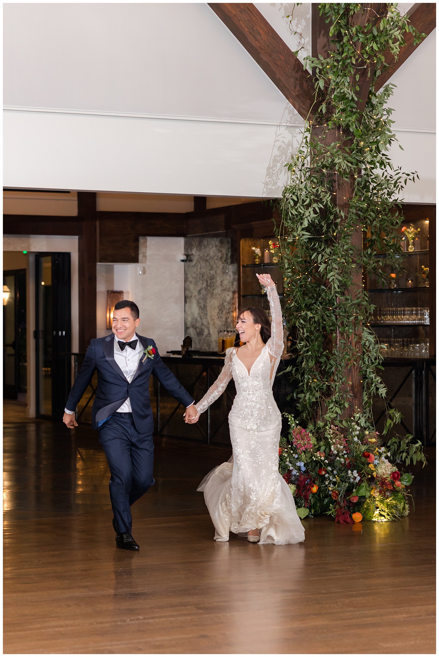 Bride and groom entering the ballroom