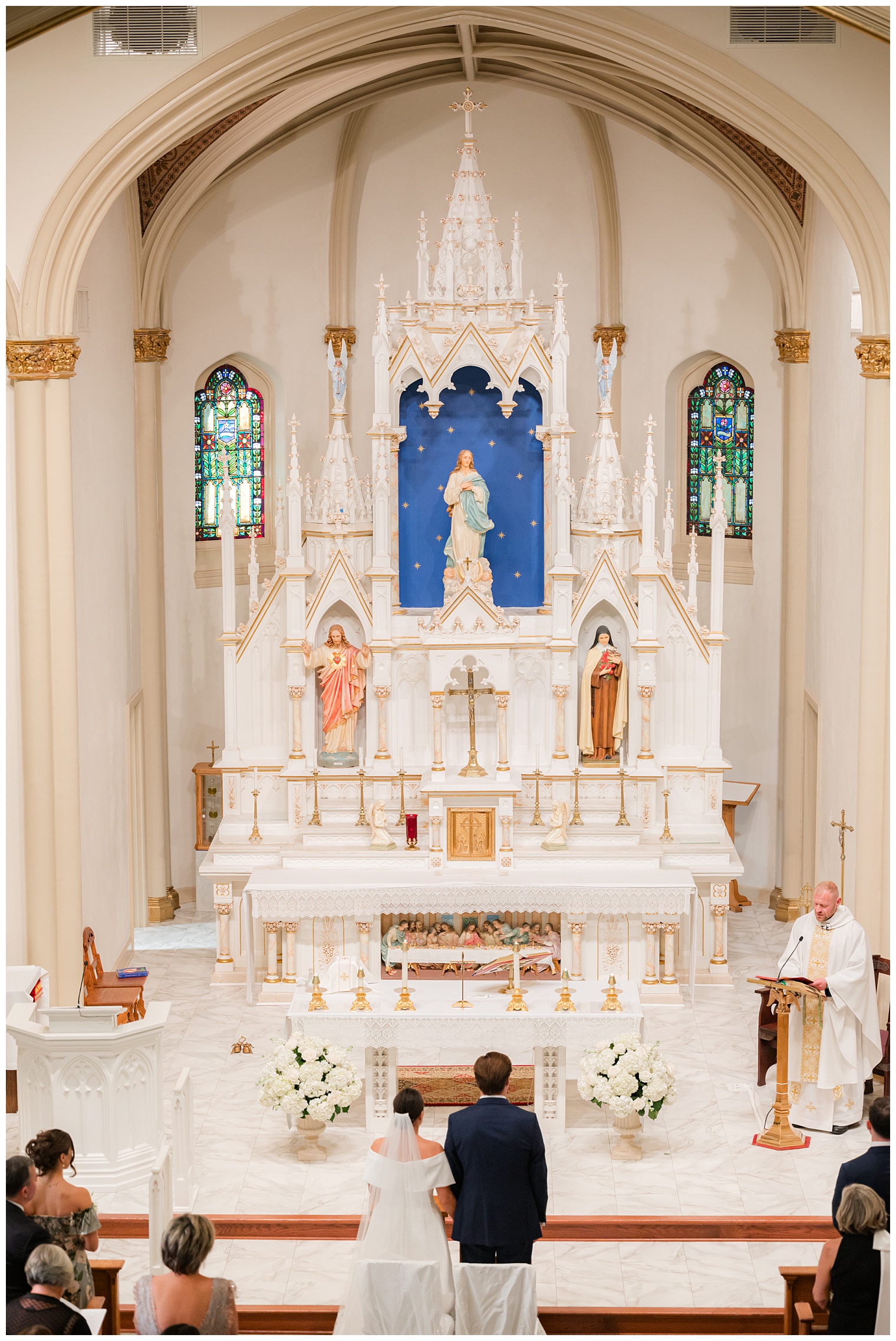 groom and bride in front of the altar