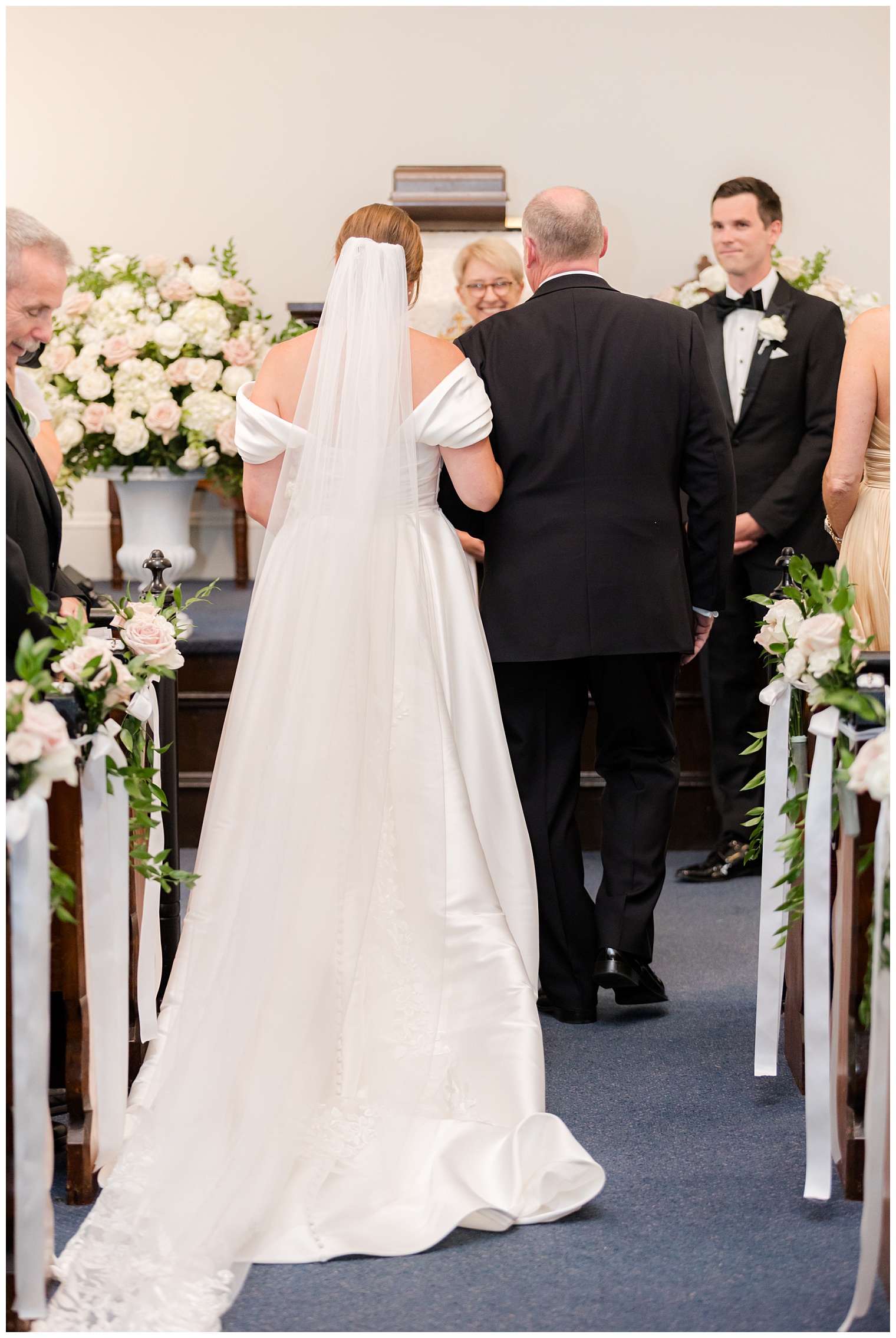 bride walking down the aisle with her father