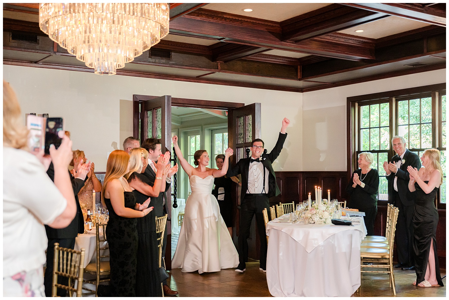 bride and groom entering the ballroom