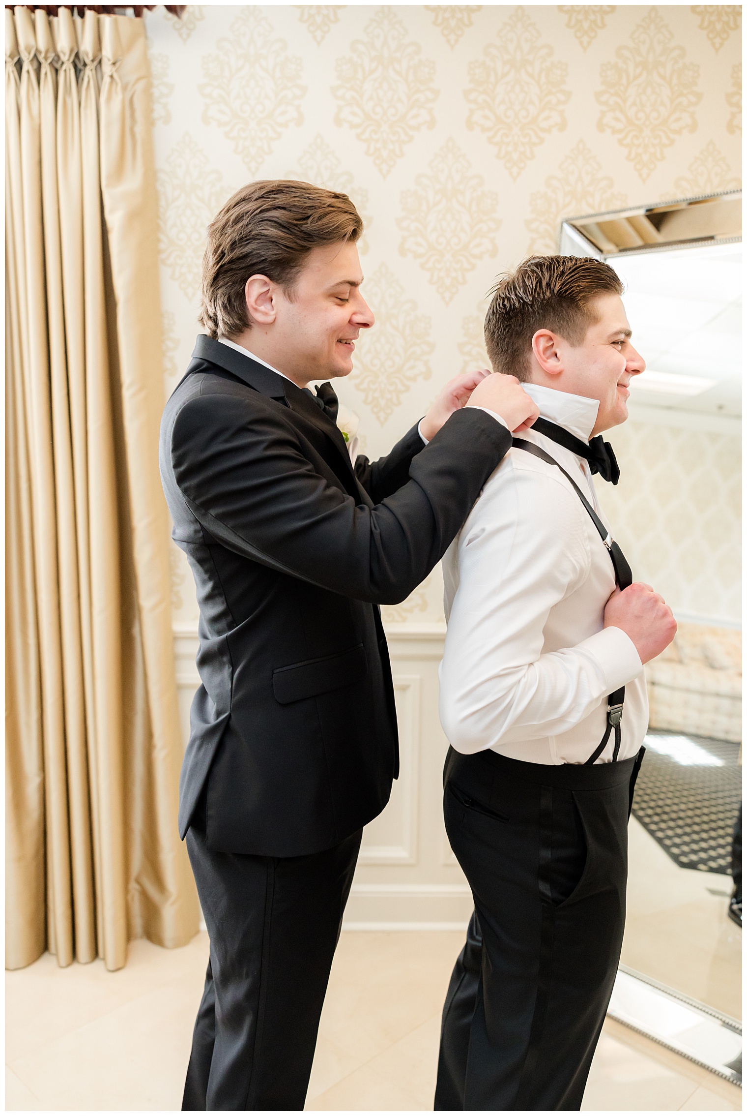 groomsman helping groom