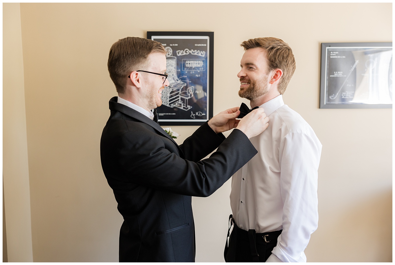 best man helping the groom get ready for the wedding