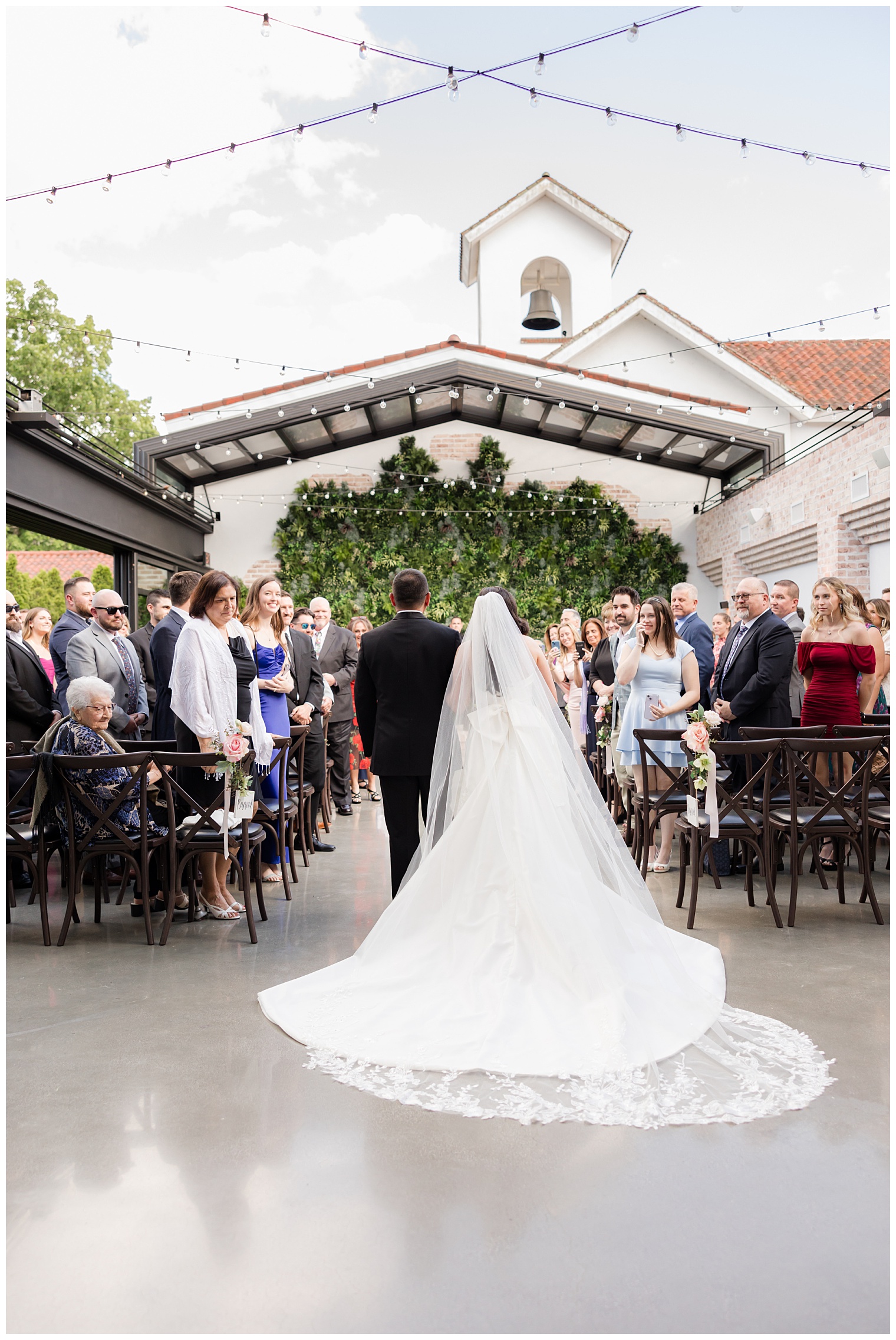 bride walking down the aisle with her father