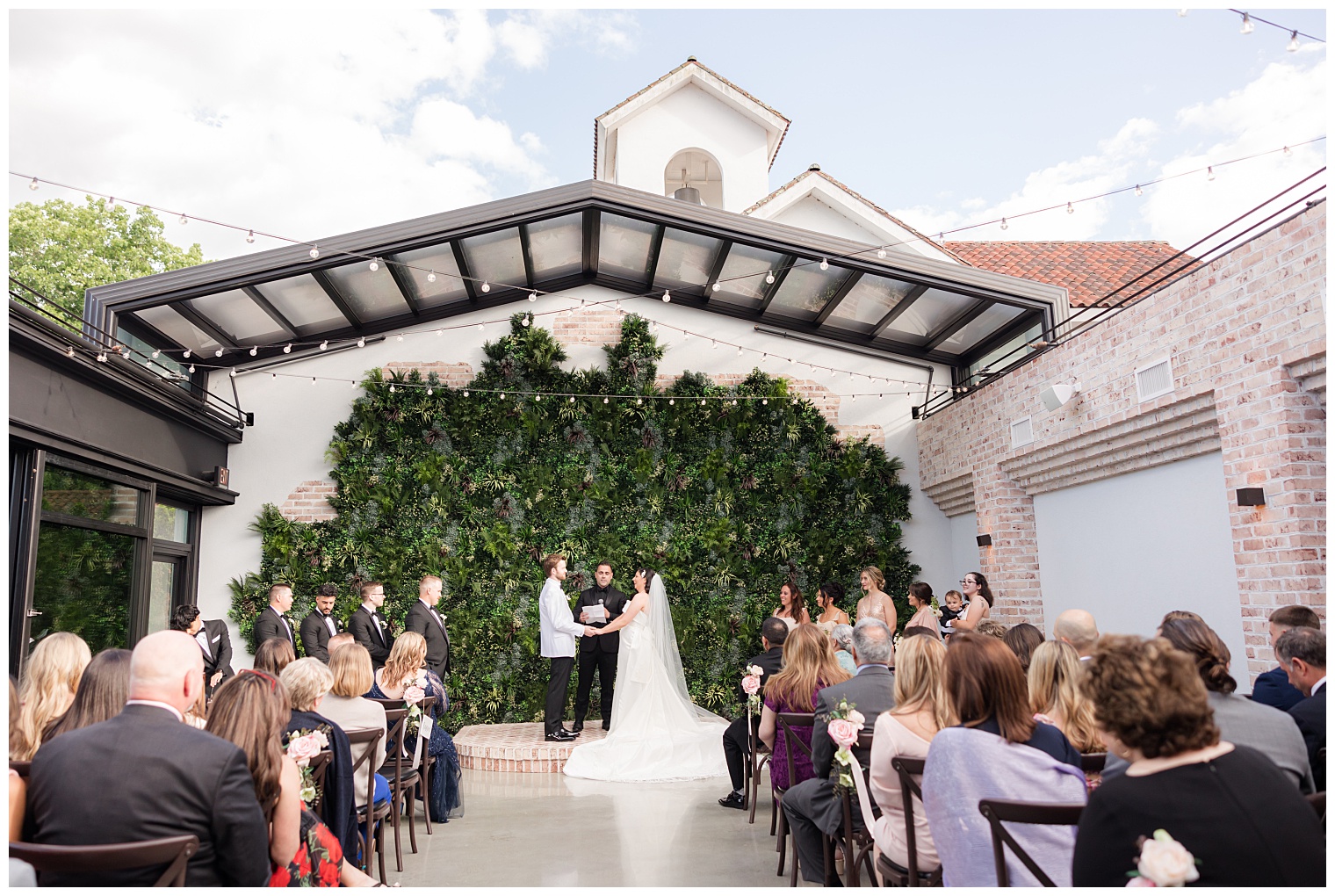 groom and bride in front of the altar