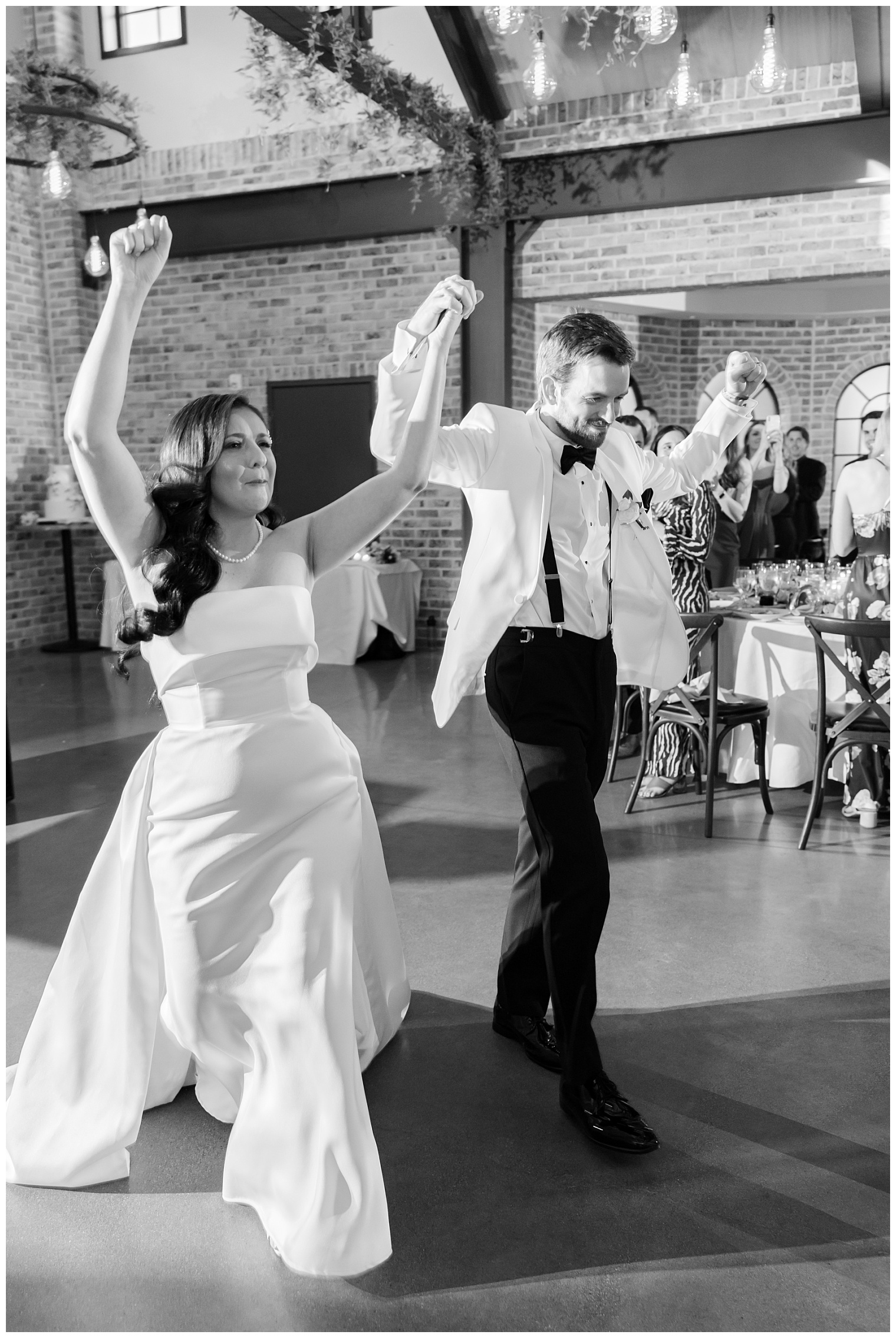 bride and groom entering the ballroom