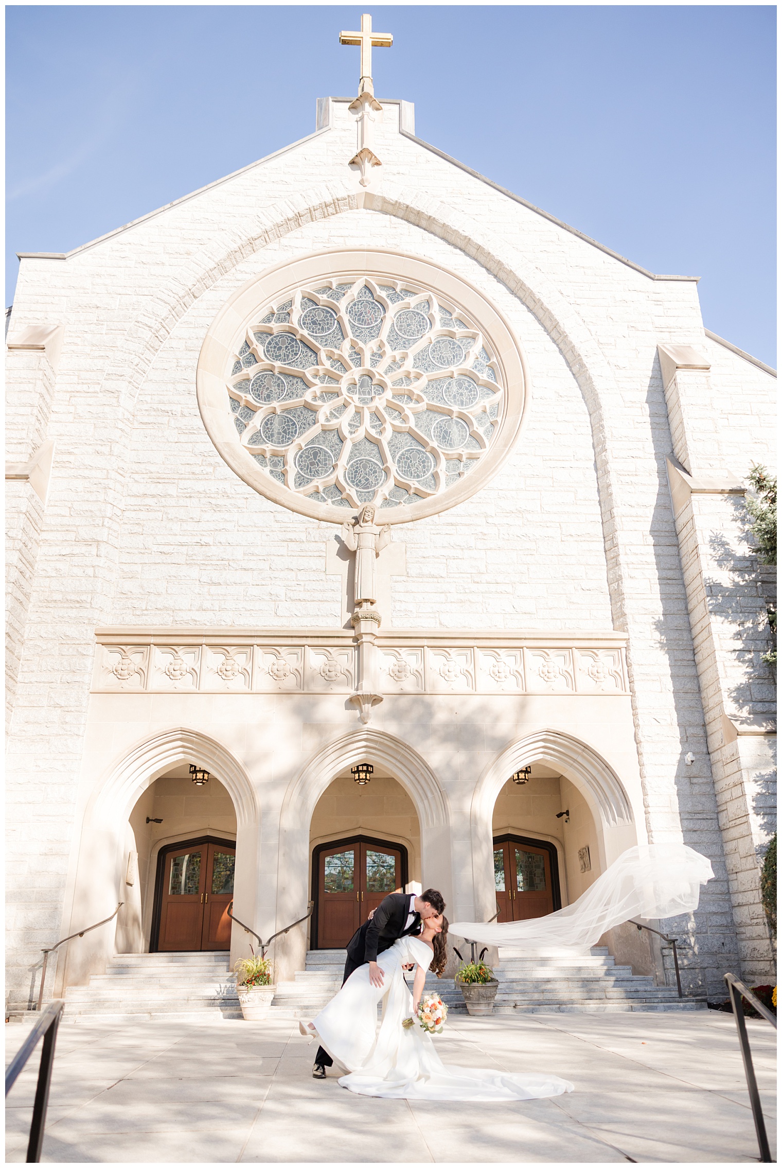 husband and wife in front of the church