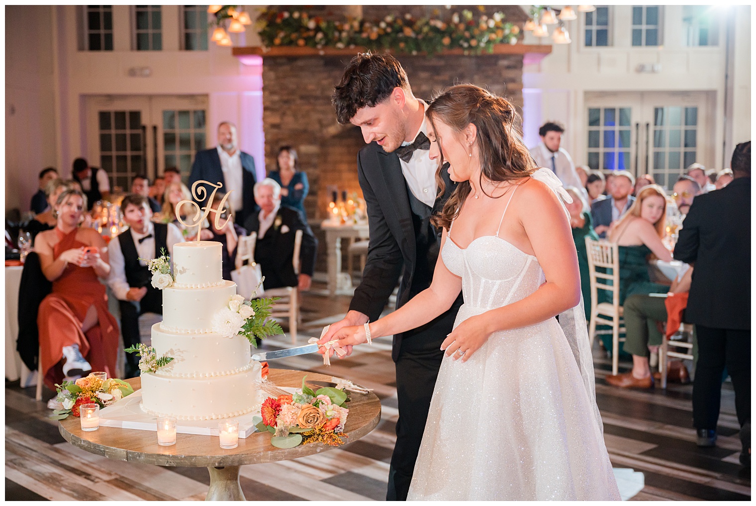 bride and groom cutting the cake